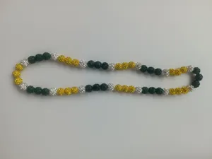 Close-up detail showing 10mm dark green, yellow, and white Shamballa rhinestone beads.