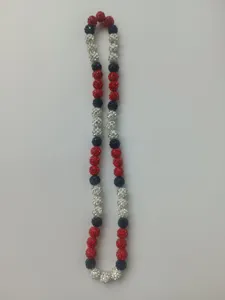 Detail view of 10mm red, white, and blue rhinestone clay beads on elastic necklace.
