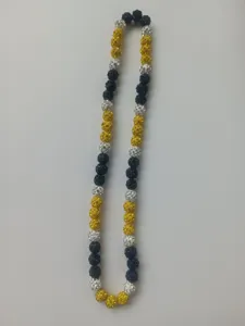 Detailed view of a 10mm rhinestone Shamballa bead necklace in black yellow and white