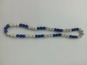 Close-up view of 10mm blue and white rhinestone clay disco bead necklace jewelry detail