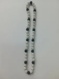Macro view of sparkly 10mm black and white Shamballa crystal clay bead necklace