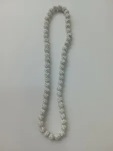 Close-up of 10mm white clay disco ball necklace with shiny AB crystals details