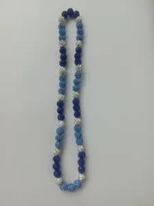 Detailed view of 10mm blue and silver rhinestone disco ball beads on a Shamballa necklace