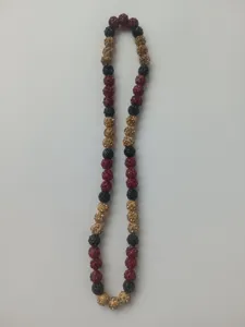 Close-up detail of 10mm Shamballa rhinestone clay bead necklace in red black and gold