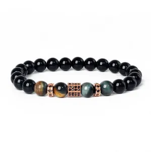 Detail view of natural stone beaded bracelet with tiger eye beads and cubic zirconia spacers.
