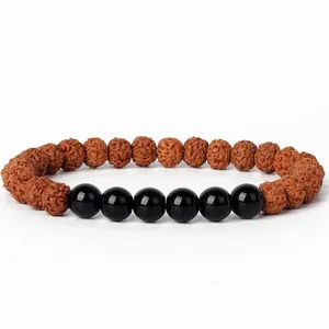 Detailed view of 7mm rudraksha and black stone bead bracelet, traditional Buddhist prayer bead.