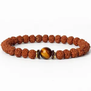 Detailed close-up of natural Vajra Bodhi beads with a central tiger's eye stone and metal accents.