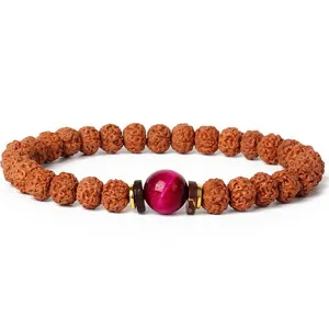 7mm small rudraksha prayer beads bracelet with vibrant red center bead and metallic spacers.