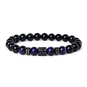 Natural stone beaded bracelet featuring purple tiger's eye and paved cubic zirconia spacers.