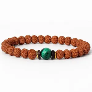 Rudraksha beaded bracelet with green stone center bead and metal spacers for daily fashion jewelry.