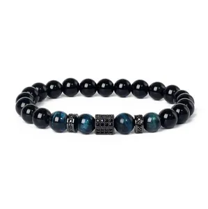 Detailed shot of beaded bracelet featuring blue tiger eye, black stones and pavé zirconia spacers.