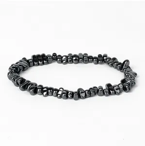 Natural hematite stone chip beaded bracelet, irregular metallic black energy jewelry detail.