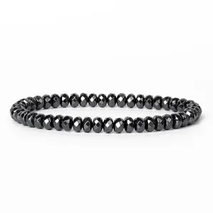 Detailed shot of 6mm faceted abacus black hematite bead bracelet, showing smooth cutting surface.