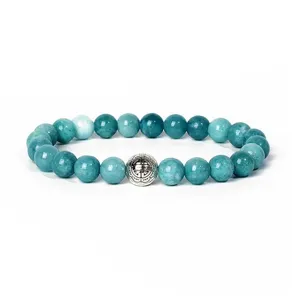 Detail view of 8mm gemstone bead bracelet featuring vintage alloy carved spacer bead.
