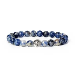 Detail view of an 8mm blue stone beaded bracelet featuring an engraved alloy spacer bead.