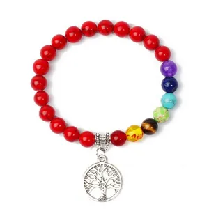 Close-up detail of the colorful chakra bead bracelet featuring silver tree pendant craftsmanship.
