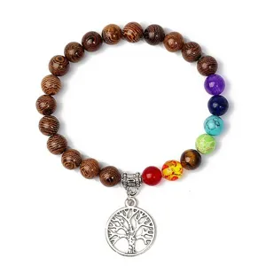 Tree of life charm bracelet with wooden beads and colorful chakra stones for yoga.