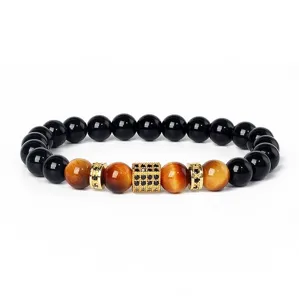 Natural tiger eye and black stone beaded bracelet with micro-paved cubic zirconia spacer.