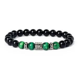 Detailed view of beaded bracelet featuring green tiger eye stones, black beads and zircon spacer.