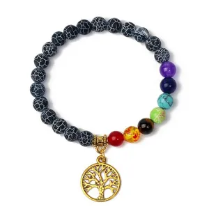 Detailed view of 8mm black stone chakra beads yoga bracelet with gold tree of life pendant.