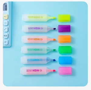 Detailed view of six vibrant colorful highlighter markers with caps off on blue background