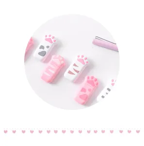 Cute mini cat paw correction tape detail close up, portable student stationery whiteout supply.