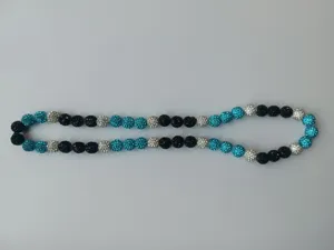 Detailed view of 10mm Shamballa crystal disco ball beads in turquoise, black and silver