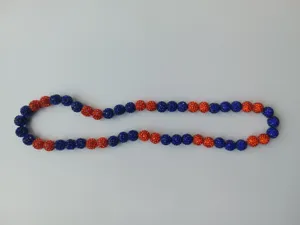 Detailed view of 10mm blue and orange rhinestone disco ball shamballa necklace