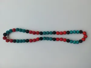 Detailed shot of 10mm Shamballa necklace with red, black, and teal disco ball beads.