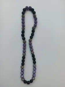 Detail view of 10mm purple and black Shamballa rhinestone clay bead necklace