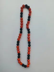 Close-up of 10mm orange and black rhinestone Shamballa bead necklace for sports fans