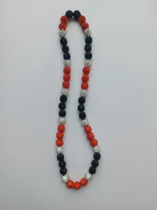 Detailed close-up of red, black and white 10mm Shamballa rhinestone bead necklace