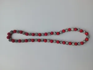 Detailed close-up of 10mm red and silver rhinestone clay beads on Shamballa string