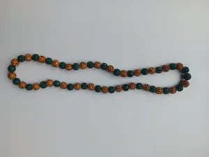 Detail of 10mm green and orange clay drill ball elastic Shambhala beaded necklace.