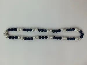 Close-up of 10mm blue and silver pave crystal clay ball beaded necklace for hip hop style