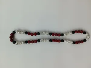 Close-up of red, black and white 10mm Shamballa style clay disco ball necklace