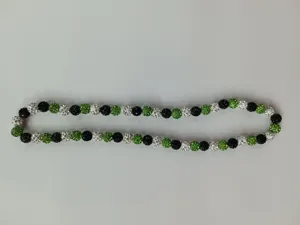 Detail of 10mm green, black and clear rhinestone Shamballa disco ball necklace