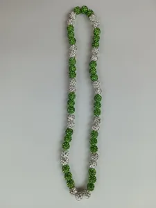 Detailed view of a 10mm green and white Shamballa rhinestone bead necklace and bracelet
