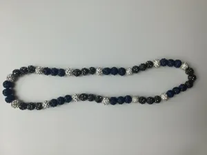 Close-up detail shot of 10mm dark blue and silver pave bead Shambhala necklace set