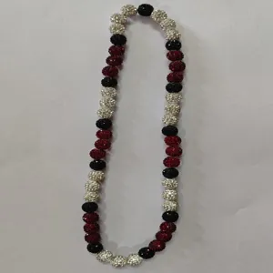 Detailed view of a 12mm Shamballa necklace with red, black, and white rhinestone beads
