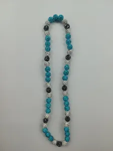 Close-up of Shamballa necklace featuring teal, silver, and black sparkling rhinestone beads