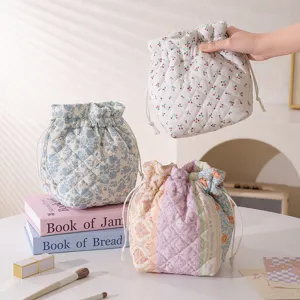 Quilted floral drawstring makeup bag with lightweight print for daily travel use