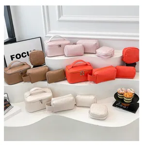 Detailed display of PU leather cosmetic bags in various colors and styles