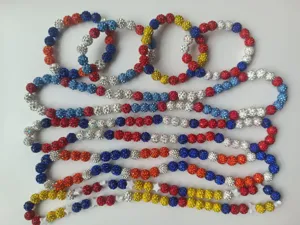 Close-up detail showing colorful clay disco ball bead necklaces in baseball colors.