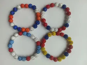 Detailed view of four 10mm rhinestone clay disco ball Shamballa elastic bracelets set