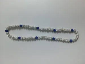Detail view of 10mm Shamballa necklace featuring white and blue AB crystal clay beads