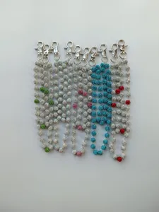 Detailed shot of sparkling rhinestone ball pocket chains with lobster clasps for fashion wear.