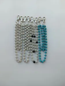 Detail view of sparkling rhinestone shamballa bead pocket chain, silver and blue options.