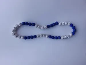 Close-up detail of shamballa necklace featuring blue and white sparkling rhinestone beads
