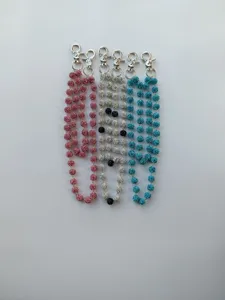 Detailed view of rhinestone disco ball pant chains, sparkling crystal waist chain accessories.